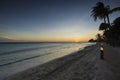 View of orange sunset in Atlantic ocean from sandy beach of island of Aruba. Royalty Free Stock Photo