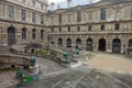 Exterior View of Louvre Museum Outside Staircase with Guard Animals