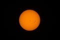 A view of our sun with sunspots through a telescope Royalty Free Stock Photo
