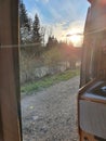 View out of the camper van onto a river in sunset. Vanlife concept