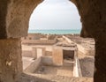 A view out of minaret`s window to the sea. Ruined old town Al Jumail, Qatar. Middle East. Persian Gulf.