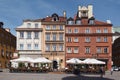 View of an outdoor cafe in front of medieval buildings at the old market square, Warsaw