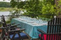 View of outdoor party table covered with sea green table cloth ready served. Beautiful nature around.