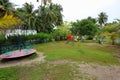 View of outdoor playground on Maldive island Danghethi. Green tropical trees on background Royalty Free Stock Photo