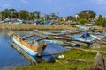 A view of outrigger canoes moored along the entrance to the lagoon in Negombo, Sri Lanka Royalty Free Stock Photo