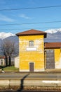 View from outside window of train at small train station and majestic Italian Alps Royalty Free Stock Photo