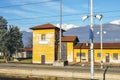 View from outside window of train at small train station and majestic Italian Alps Royalty Free Stock Photo