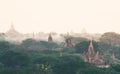 View over ancient temples of Bagan complex during sunrise golden hour in Myanmar Royalty Free Stock Photo