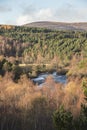 View over Autumn forest and River Dulnain at Sluggan in the Highlands of Scotland.