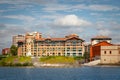 View over the blue water of the river Garonne on the apartment buildings in Promenade du Bazacle