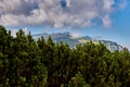 View over the Bucegi Mountains in the Carpathians with the Costila Peak to the left and the Heroes` Cross on the Caraiman Peak to