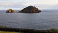 View over the calm ocean and Ilheu de Vila Franca do Campo island in Azores, Portugal