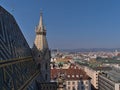 View over the center of Vienna, Austria with the colorful tile roof of famous church Stephansdom on sunny day. Royalty Free Stock Photo