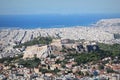 View over the city and the Acropolis from Lycabettus hill in Athens, Greece. Panorama of Athens . Beautiful cityscape with seashor Royalty Free Stock Photo