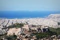 View over the city and the Acropolis from Lycabettus hill in Athens, Greece. Panorama of Athens . Beautiful cityscape with seashor Royalty Free Stock Photo