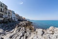 View over the coastline and residential buildings from Bastione di Capo Marchiafava bastion lookout point on a sunny day in Cefalu