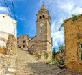 View over the cobblestone historic access road to Motovun with evangelical church during the day