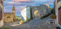 View over the cobblestone historic access road to Motovun with evangelical church during the day