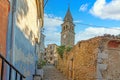 View over the cobblestone historic access road to Motovun with evangelical church during the day