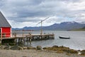 View over the fjord with a wooden jetty, and beautiful mountains & islands in the background, Eskifjordur, East Iceland Royalty Free Stock Photo