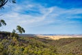 Forested hills and distant wheat fields in the Western Australian wheatbelt Royalty Free Stock Photo