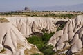 Volcanic rock formations known as fairy chimneys and extreme terrain of Cappadocia, Turkey Royalty Free Stock Photo