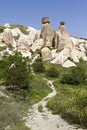 Volcanic rock formations known as fairy chimneys and extreme terrain of Cappadocia, Turkey Royalty Free Stock Photo