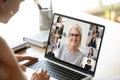 Diverse woman involved in group videocall, laptop screen view Royalty Free Stock Photo