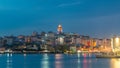 View over golden horn bay on the galata tower and its neighborhood day to night timelapse in Istanbul. Royalty Free Stock Photo