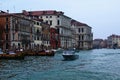 View over Grand Canal in Venice. Moored boats near colorful ancient buildings. Royalty Free Stock Photo