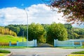 View over grand entrance into a countryside estate in Hawke's Bay, New Zealand. Road driveway walled by turning Royalty Free Stock Photo