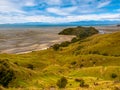 View over Grassland at Puponga bay, South Island, New Zealand Royalty Free Stock Photo