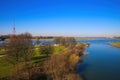 View over green pasture pensinsula MÃÂ¼hlenweide at river rhine against blue sky in winter - Duisburg, Germany