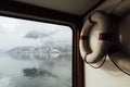 View over Hallstatt town and Alps mountains from inside the ferry