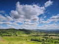 View over Hope Valley and Lose Hill with billowing white clouds and blue sky, Peak District, UK Royalty Free Stock Photo