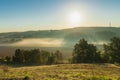 A view over the Jeker valley covered in mist in the rolling hill landscape of south Limburg Royalty Free Stock Photo