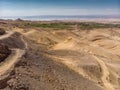 View over the Jordanian desert over the irrigated plantations and the saltworks at the Dead Sea with the coast of Israel in the