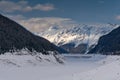 Frozen dam lake in the Alps