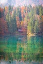 Lake Laghi di Fusine in autumn with a small hut Royalty Free Stock Photo