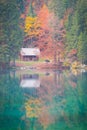 Lake Laghi di Fusine in autumn with a small hut Royalty Free Stock Photo