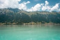 View over the lake at with mountains in the background.