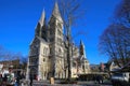 View over market square on medieval late romanesque church from 13th century with two front towers against blue winter sky Royalty Free Stock Photo