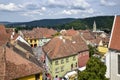 View over medieval fortress Sighisoara city, Transylvania. Ancient city from observation tower against background of mountains Royalty Free Stock Photo