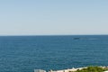 View over the Mediterranean from Monaco harbor. A Wally Power 118 luxury fast yacht cruising on an easterly course..