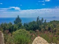 View over meditteranean scrublands onto sea water