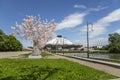 View over the Moscow State Circus on Vernadskogo Prospekt with blooming spring trees, sunny day, Russia