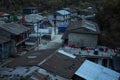 View over the mounatin village Dharapani with prayer flags Royalty Free Stock Photo