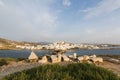 View over Naxos old town throught the ancient marble doorway monument Portara at sunset, Greece. Royalty Free Stock Photo