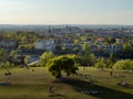 View over old town of Cracow from Krakus mound. In the front people relaxing on the grassland.