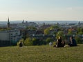 View over old town of Cracow from Krakus mound. In the front people relaxing on the grassland.